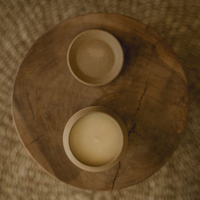 candles on a plate in brown background f zeen boutique